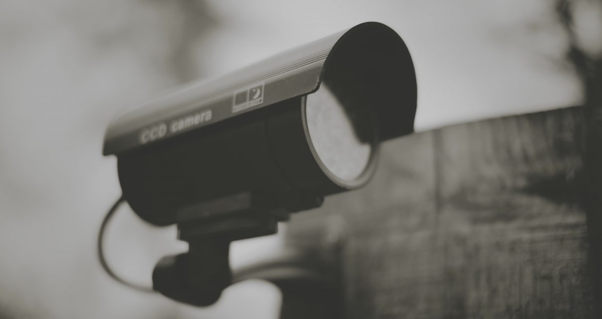 black and silver camera on black stand